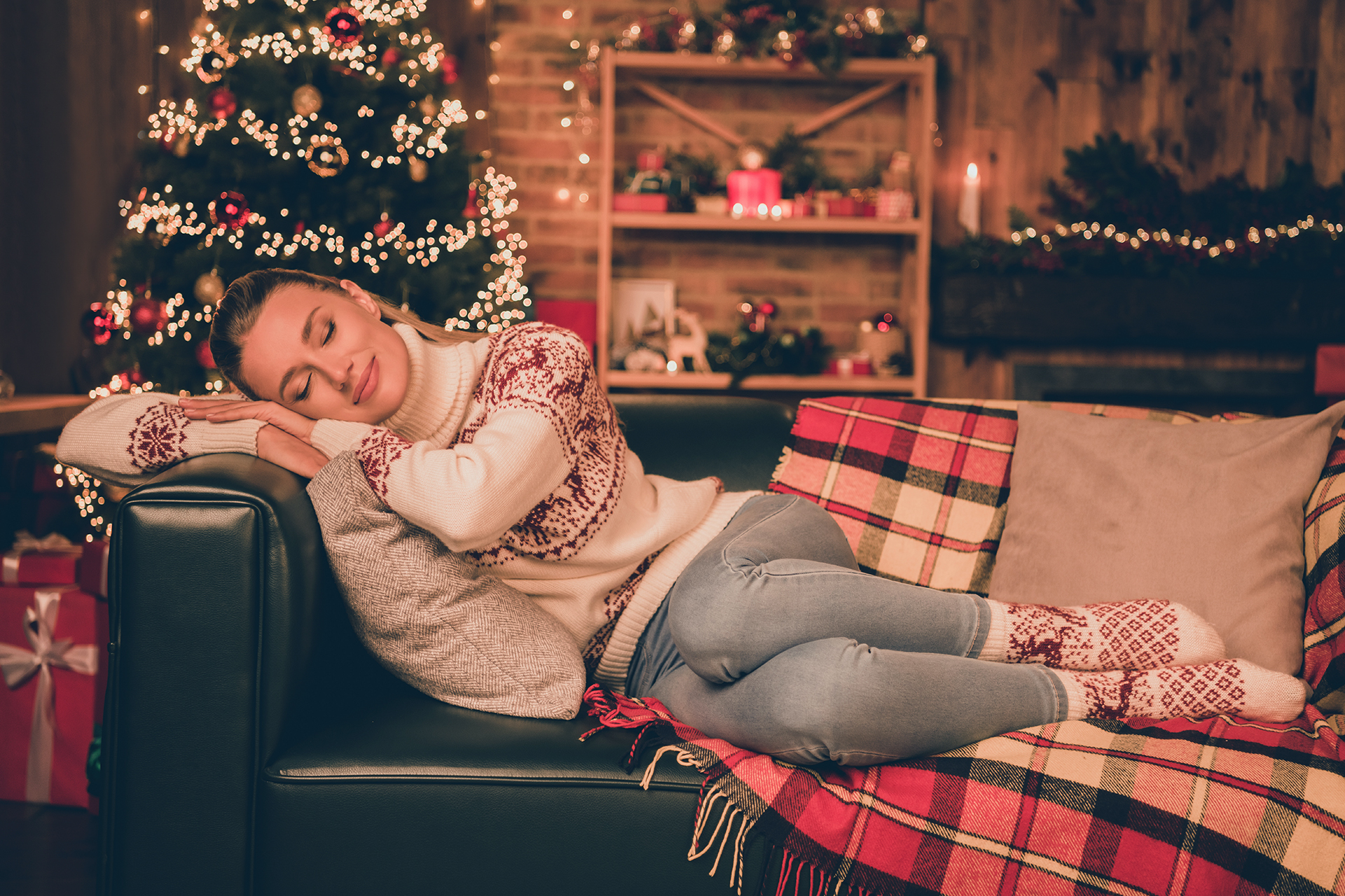 Alone in a new city during Christmas - Photo of pretty dreamy young lady dressed print pullover enjoying christmas time smiling indoors room home house