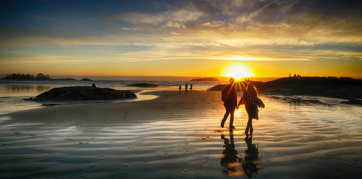 couple on Vancouver Island beach at sunrise