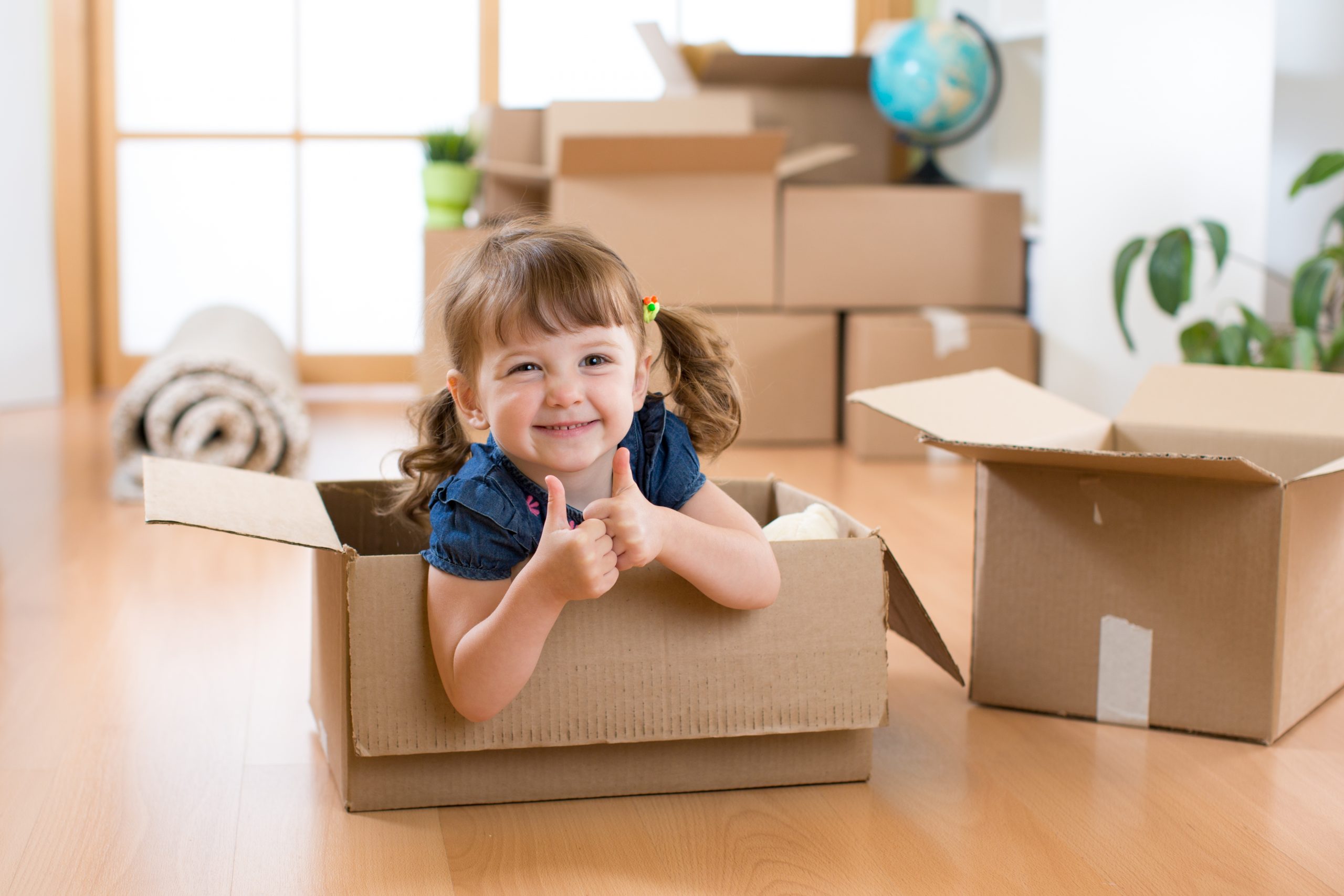 Help your kids move - Hendra Moving and Storage - girl in a moving box