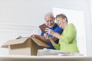 Older Couple packing boxes - Hendra Moving and Storage